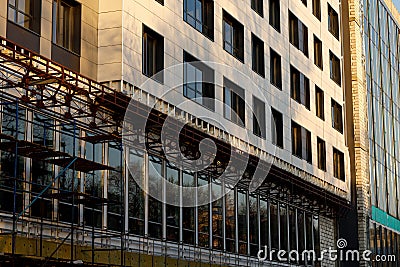 Finishing the facade of the building with a ventilated facade. A fragment of a residential building, hotel, hospital or other Stock Photo