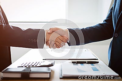 Finishing up a meeting, handshake of two happy business people a Stock Photo