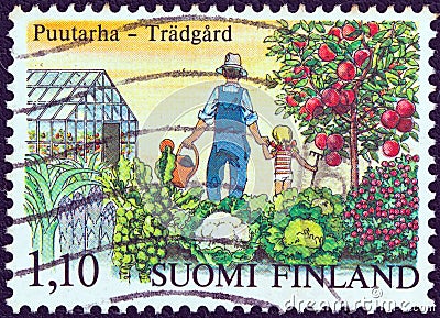 FINLAND - CIRCA 1982: A stamp printed in Finland from the `Centenary of first Finnish horticultural society` issue shows a man and Editorial Stock Photo