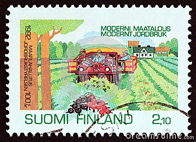 FINLAND - CIRCA 1992: A stamp printed in Finland shows Currant Harvesting, circa 1992. Editorial Stock Photo