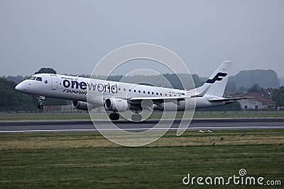 Finnair One World plane taking off from runway Editorial Stock Photo