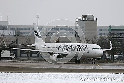 Finnair taxiing on a snowy runway Editorial Stock Photo