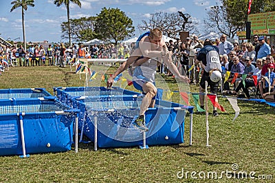 Finnish wife carrying competition. Editorial Stock Photo