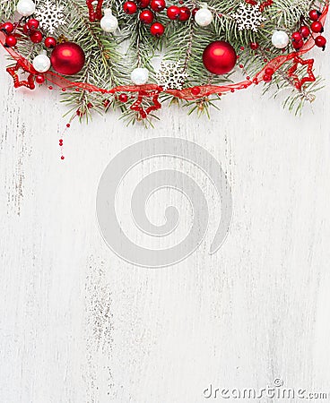 Fir branch with Christmas decorations on old wooden shabby background with empty space for text. Top view Stock Photo