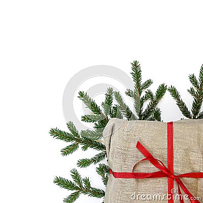 Fir branch / twig and burlap canvas christmas gift box on white Stock Photo