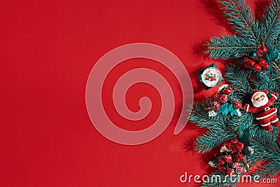 Fir branches border on red background, good for christmas backdrop Stock Photo