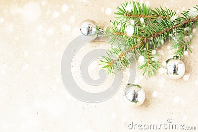 Fir tree branches decorated with silver christmas balls as border on a snow rustic holiday background frame Stock Photo