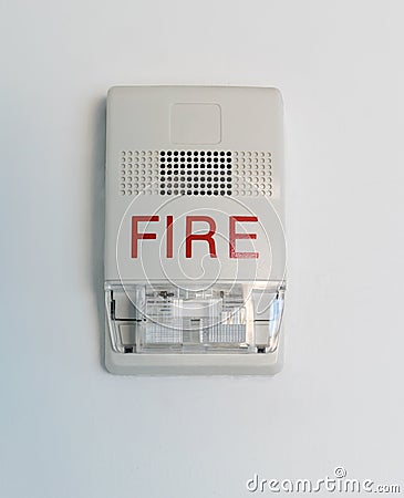 Fire alarm siren with flashing light strobe on white Stock Photo