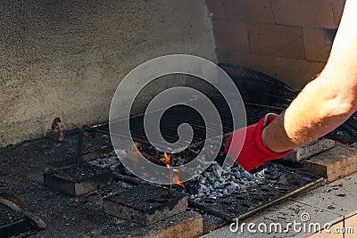 Fire in a barbaque, setting fire on coal barbacue Stock Photo