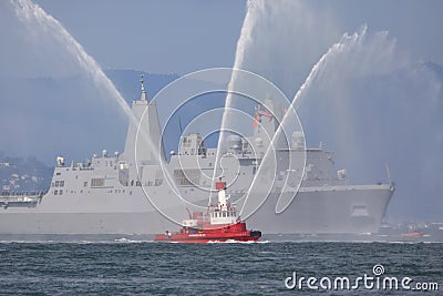 Fire-boat with Naval Ship Stock Photo