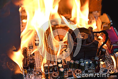 Fire Burning ,blazing computer motherboard, cpu,gpu and video card, processor on circuit board with electronic Stock Photo