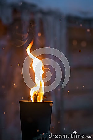 Fire burning inside metal torch Stock Photo