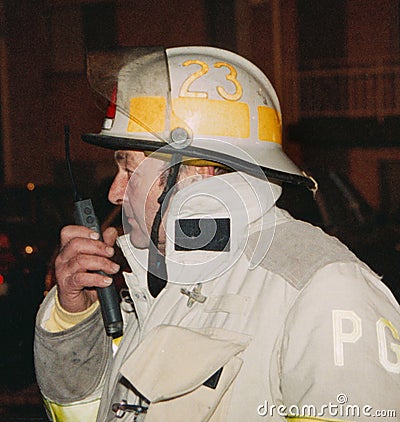 Fire chief maintains communications with other firefights Editorial Stock Photo