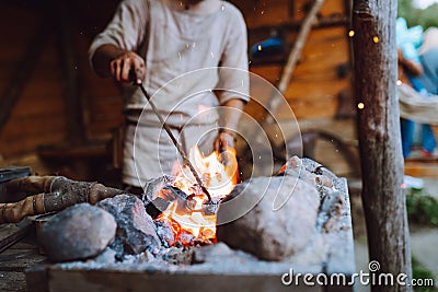 Fire crackling in blacksmith workshop of forging metal. Anonymouse craft smith create objects from wrought iron or steel Stock Photo