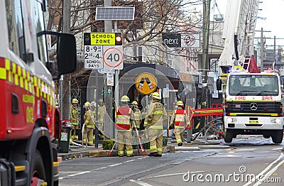 Fire crew and engineers at work at site of explosion Editorial Stock Photo