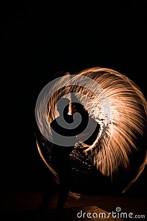 Fire dancing show in the night time at the beach Stock Photo