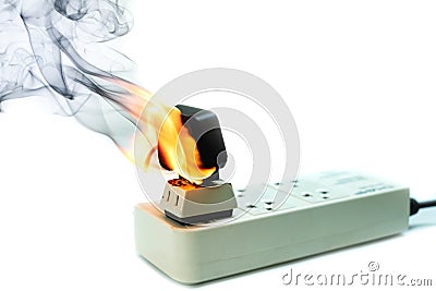 On fire electric wire plug Receptacle and adapter on white background Stock Photo