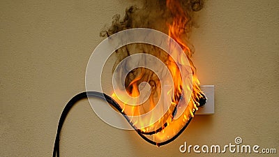 fire electric wire plug Receptacle on the concrete wall background Stock Photo