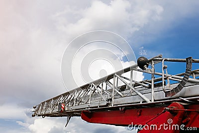 Fire escape closeup on blue sky background Stock Photo