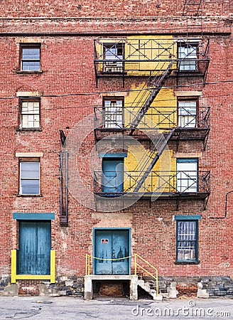 Fire escapes on abandoned factory Stock Photo