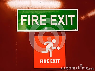 Fire exit door with symbol and arrow Stock Photo