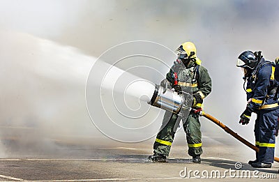 Fire extinguish the fire with foam in the smoke. Editorial Stock Photo