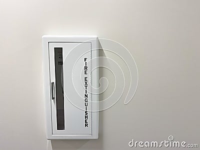 A fire extinguisher in a hallway of an apartment building in Orlando, Florida Editorial Stock Photo