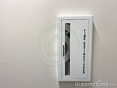 A fire extinguisher in a hallway of an apartment building in Orlando, Florida Editorial Stock Photo