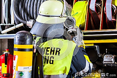 Fire fighter with breathing protection and oxygen tank Stock Photo