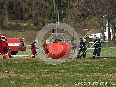 Fire-fighters in action Stock Photo