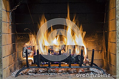 Fire in fireplace. Closeup of firewood burning in fire. Stock Photo