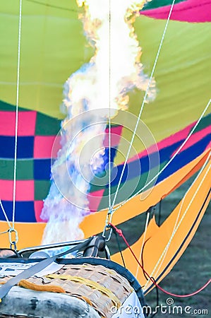 Fire heats the air inside a hot air balloon Stock Photo