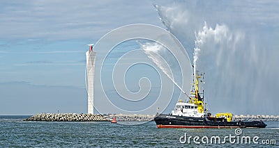 Fire hose boat `The Zeehond` spraying water in Oostende Editorial Stock Photo