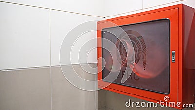 Fire Hose cabinet in red color emergency equipment. it use when on fire Stock Photo