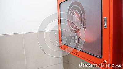 Fire Hose cabinet in red color emergency equipment. it use when on fire Stock Photo
