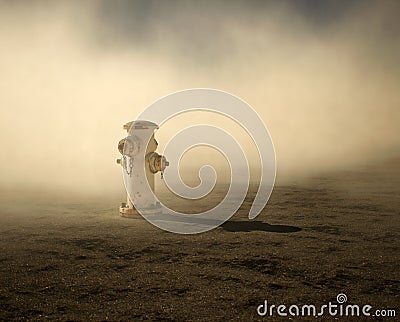 Fire hydrant supply on cracked tarmac street. Stock Photo