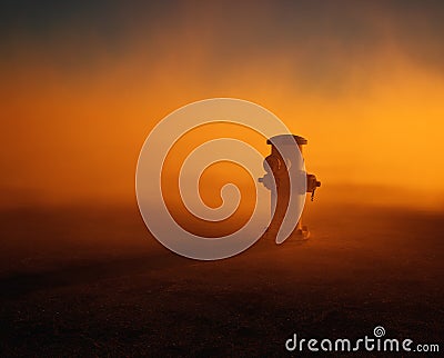 Fire hydrant supply on cracked tarmac street in mist. Stock Photo