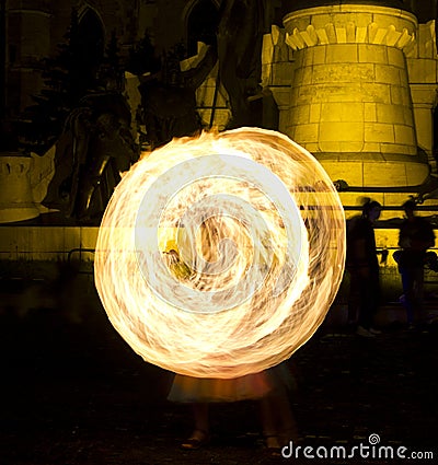 Fire juggling and fire swirls Stock Photo