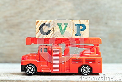 Fire ladder truck hold letter block in word CVP Abbreviation of Cost Volume Profit or Central venous pressure Stock Photo