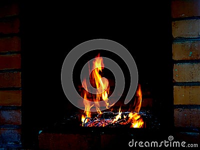 A fiery horse gallops across a burning field Stock Photo