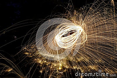 Fire Poi, Flaming Steel Wool Spinning Stock Photo