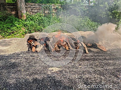 Fire red yellow black coal grass soil pollution air Stock Photo