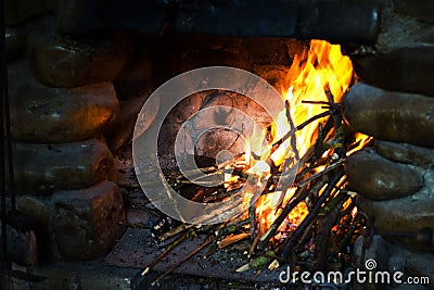 Fire in a rustic fireplace Stock Photo