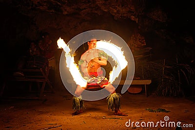 Fire show in famous Hina cave, blurred motion, Oholei beach, Ton Editorial Stock Photo