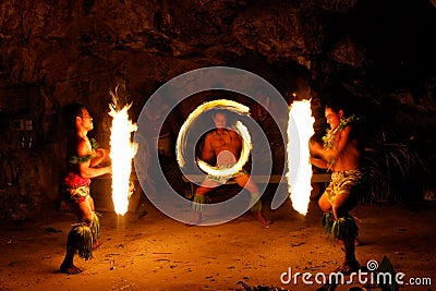 Fire show in famous Hina cave, blurred motion, Oholei beach, Ton Editorial Stock Photo