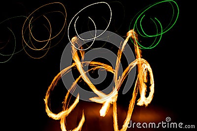 Fire Show Fiery Motion. Night Performance Abstract Drawing. Stock Photo