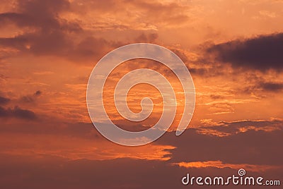Fire sky background. Soft clouds with the hint of the sun at sunset. Many orange tones and patterns of clouds Stock Photo