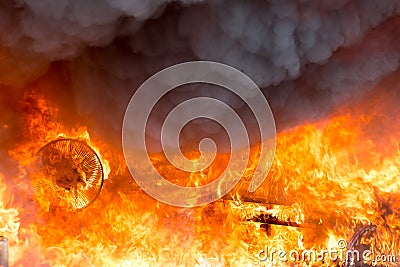 Fire and smoke from furniture burning in conflagration Stock Photo