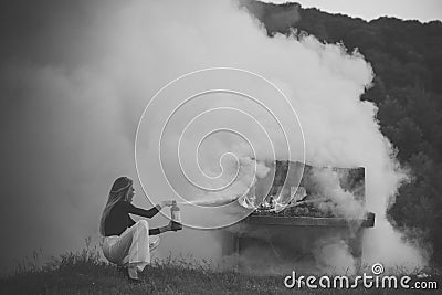 Fire and smoke on grunge instrument. fire and white smoke at burning piano and girl firefighter. Stock Photo