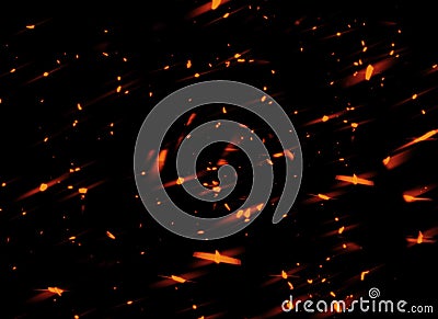 Fire sparks flying up. Glowing particles on a dark background textire for text or space Stock Photo